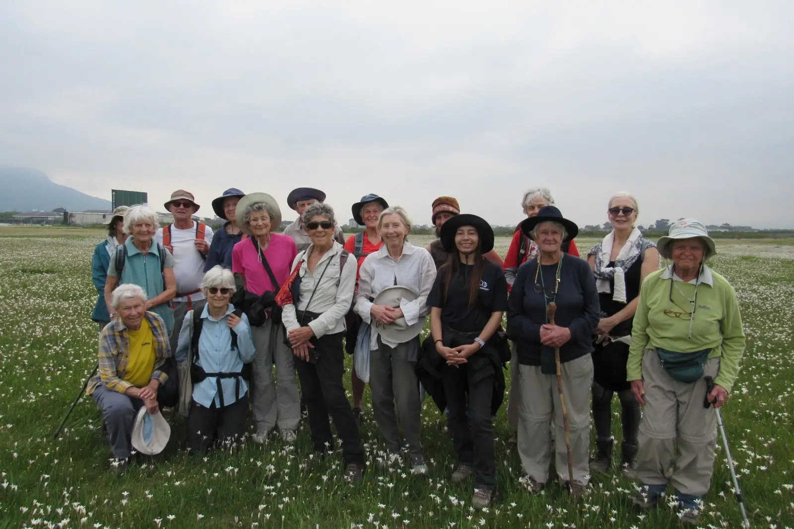 Participants of the botanical walking group posed for a photo among the plethora of Buttersilk lillies (Sparaxis bulbifera)